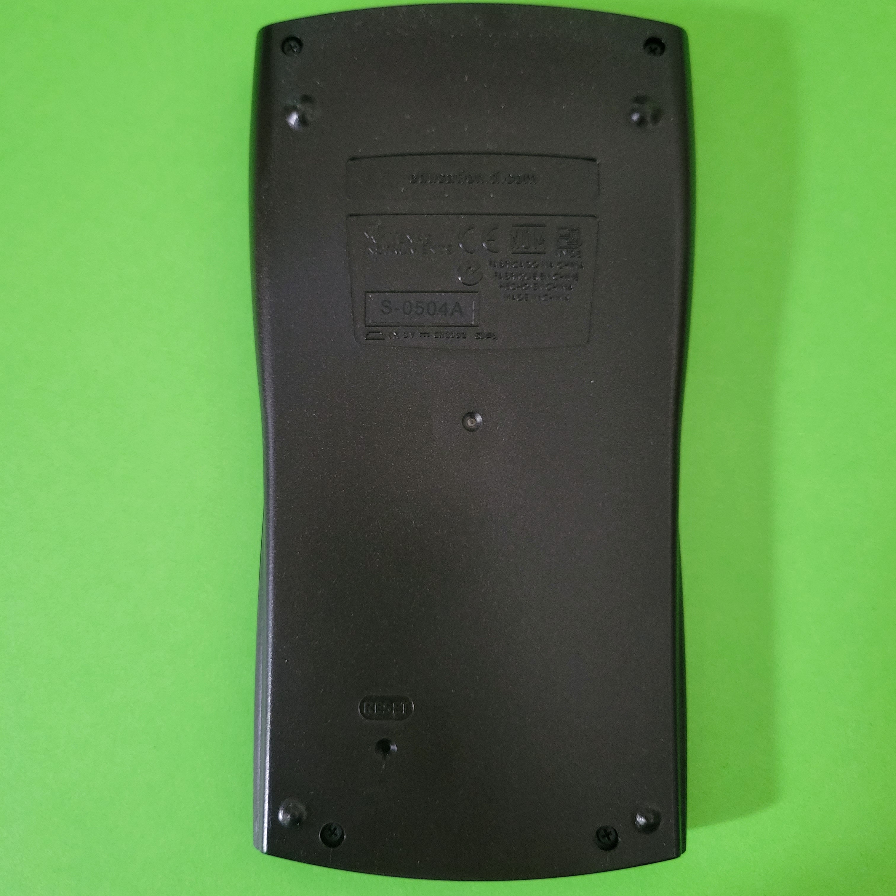 An image of the back of a texas instruments baii plus financial calculator